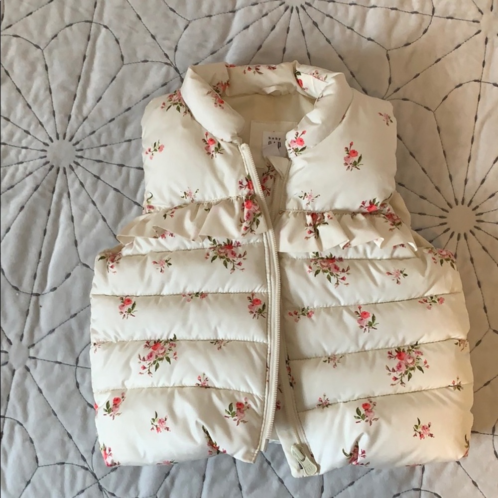 Baby Gap cream and floral puffer vest